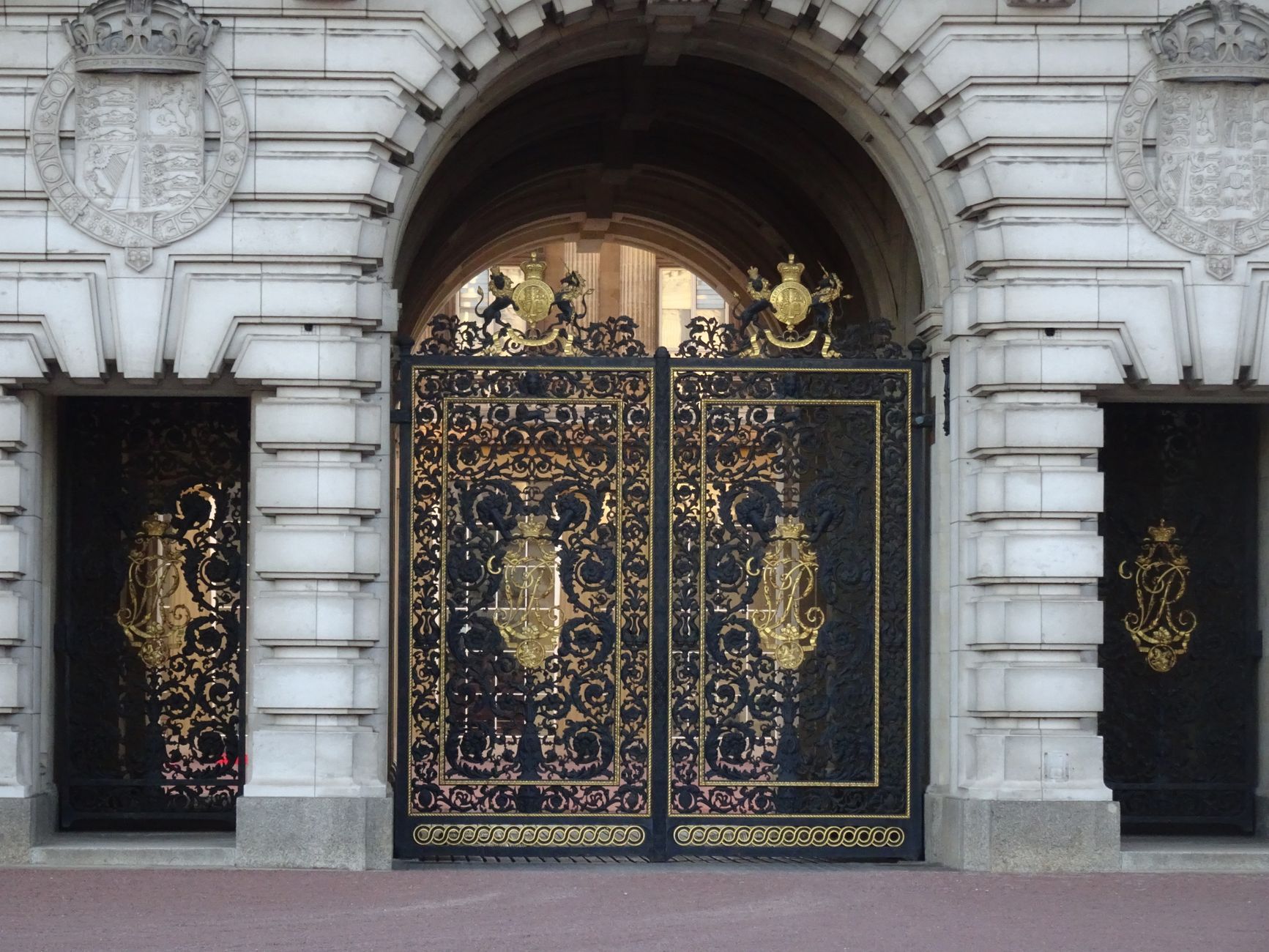 Close-up of ornate black and gold iron gates